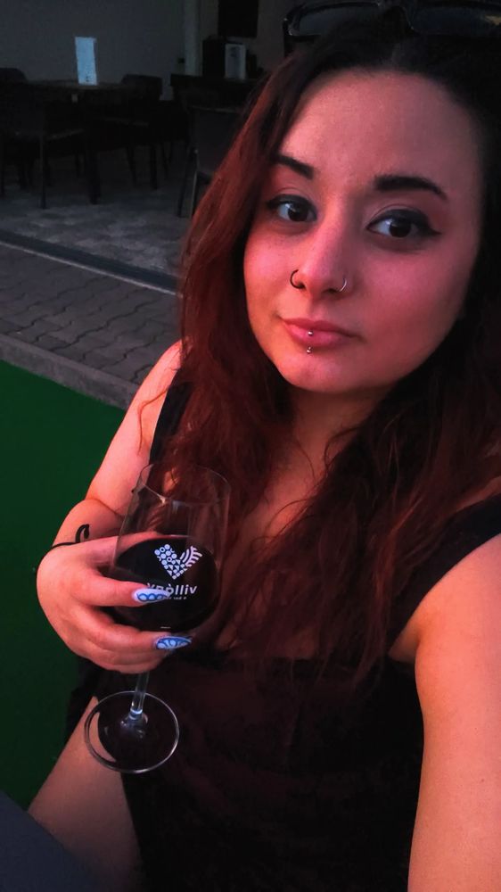 Our social media manager with a glass of red